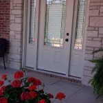 Exteriorviewofsidelightsandfrontglassdoor Shutter ColumbiaBlindsandShutters