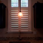 Shutteroverthesinkwithahighfaucet SpecialtyWindowCoverings ColumbiaBlindsandShutters