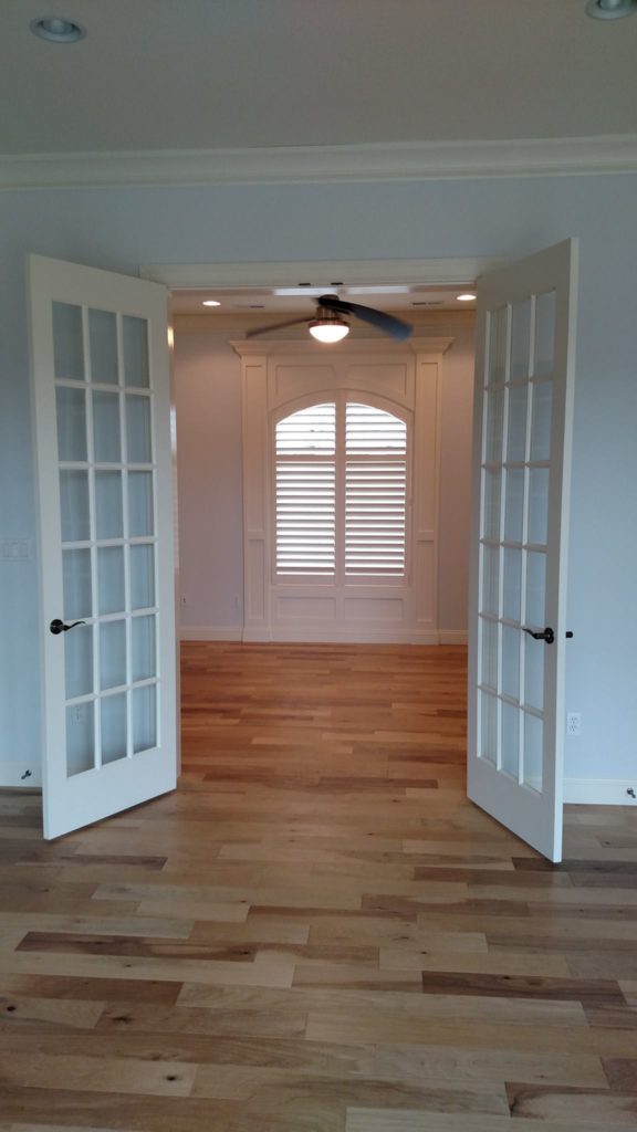 Beautiful arched shutters installed at Old Howthorne in Columbia by Columbia Blinds and Shutters